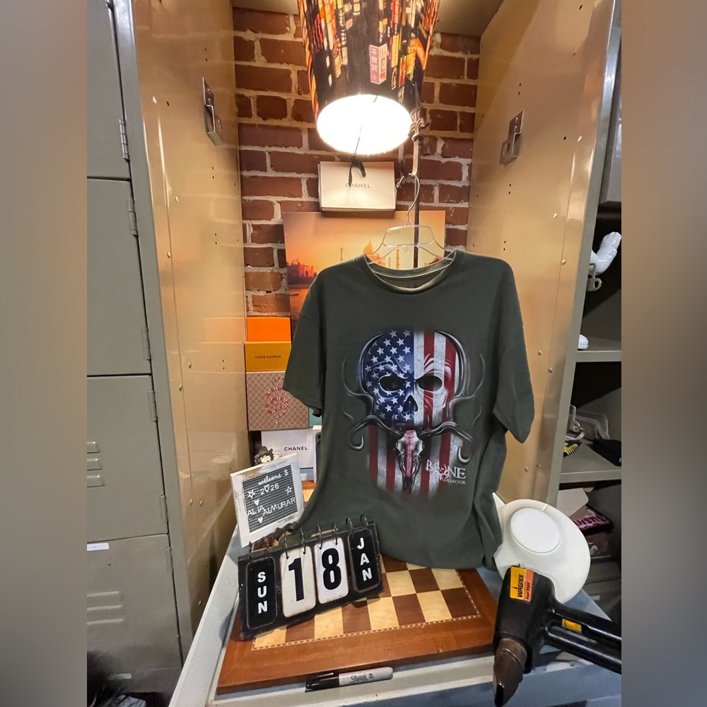 Bone Collector branded short-sleeve shirt featuring American flag skull graphic